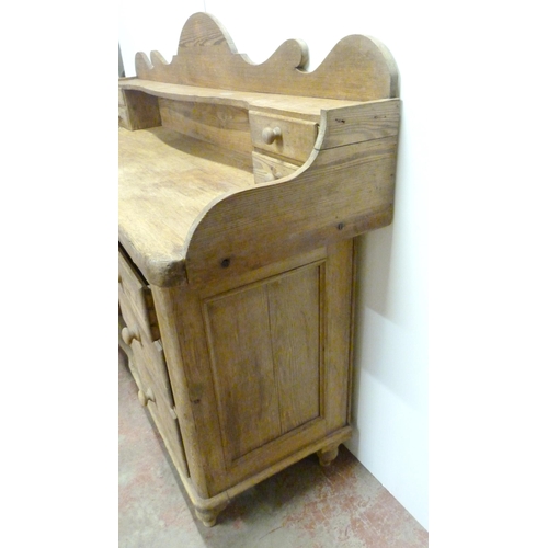 529 - Victorian scumbled pine dresser, the shaped gallery with short drawers above further short drawers a... 