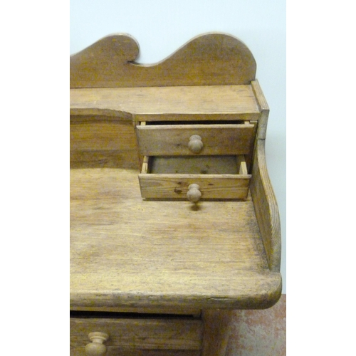 529 - Victorian scumbled pine dresser, the shaped gallery with short drawers above further short drawers a... 