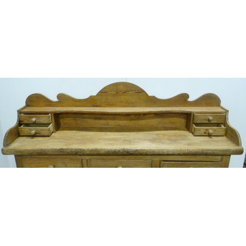 529 - Victorian scumbled pine dresser, the shaped gallery with short drawers above further short drawers a... 