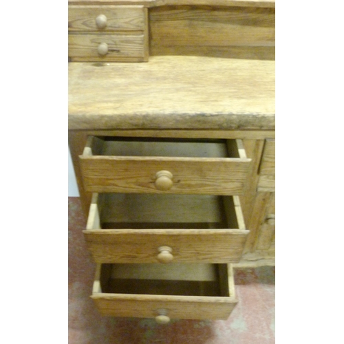 529 - Victorian scumbled pine dresser, the shaped gallery with short drawers above further short drawers a... 