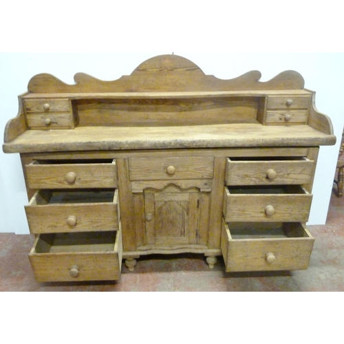 529 - Victorian scumbled pine dresser, the shaped gallery with short drawers above further short drawers a... 