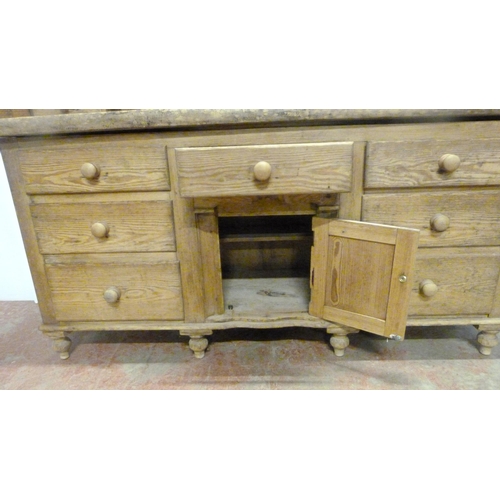 529 - Victorian scumbled pine dresser, the shaped gallery with short drawers above further short drawers a... 