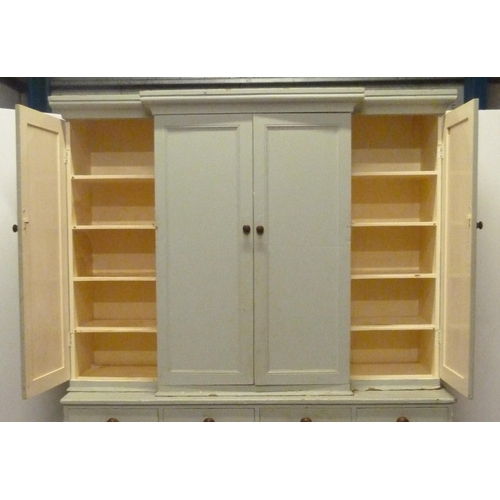 530 - Victorian painted pine breakfront housekeeper's cupboard, with four large doors to the top section e... 