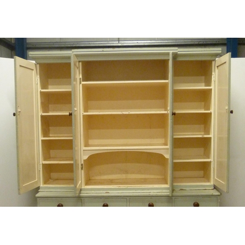 530 - Victorian painted pine breakfront housekeeper's cupboard, with four large doors to the top section e... 