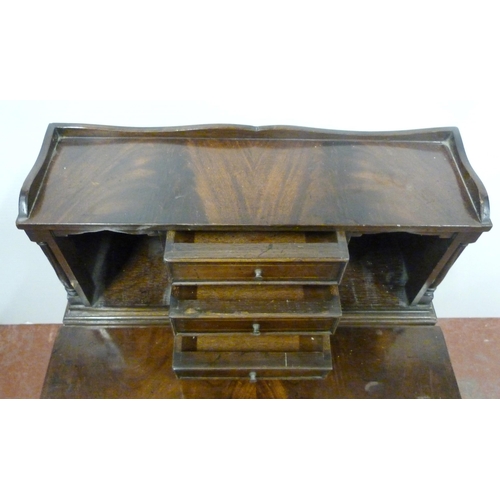 532 - Reproduction bonheur du jour, the superstructure top with three short drawers and pigeonholes, fold-... 