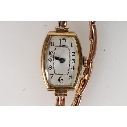 211 - 18ct gold cased ladies wristwatch on 9ct gold expanding strap, the shaped dial with arabic numerals,... 