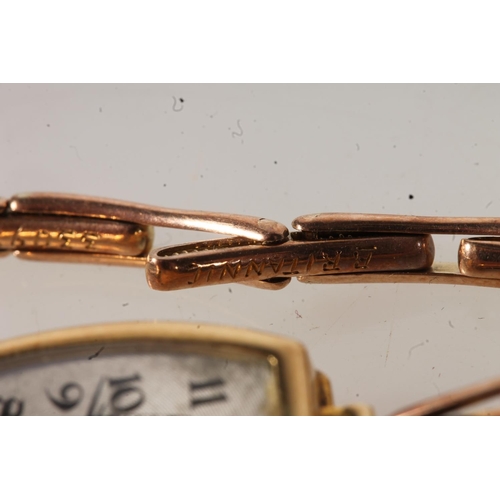 211 - 18ct gold cased ladies wristwatch on 9ct gold expanding strap, the shaped dial with arabic numerals,... 