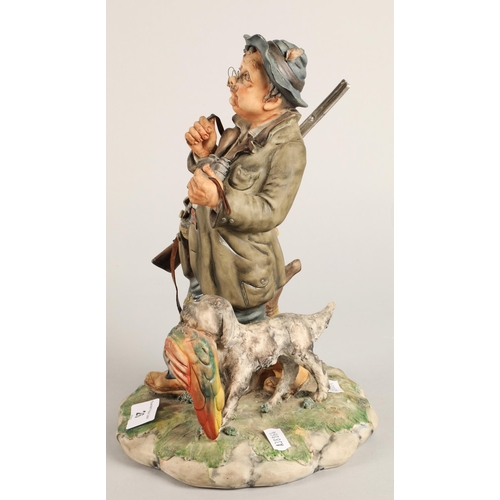 26 - Capodimonte figure of a gamekeeper with a dog 