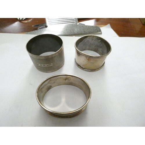 384 - Three silver napkin rings 68g gross.