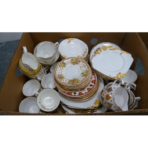 56 - Two cartons containing a large collection of miscellaneous china teawares to include Bell China, Roy... 