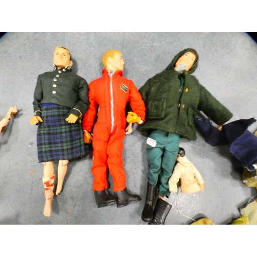 73 - Collection of Action Man figures with clothing and accessories, and another figure.