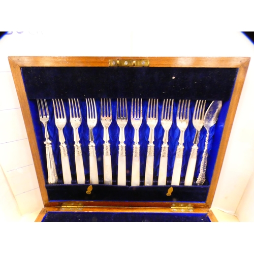 77 - Near-set of fruit knives and forks with mother of pearl handles, also a preserve spoon and fork.