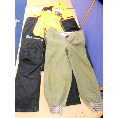 83 - Pair of plus-fours and two pairs of Husqvarna chainsaw trousers.