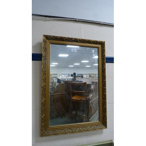 85 - Modern gilt-framed wall mirror.