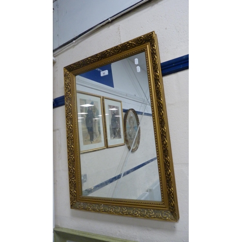 85 - Modern gilt-framed wall mirror.