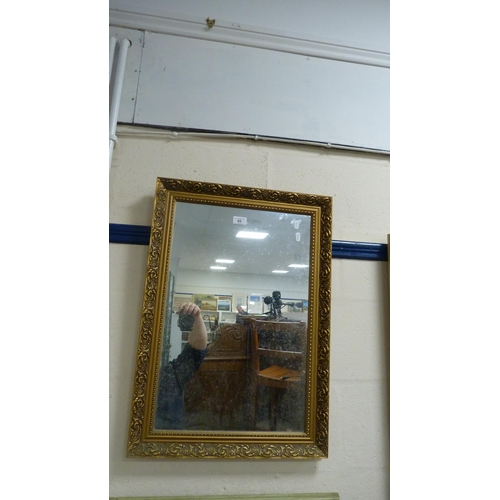 85 - Modern gilt-framed wall mirror.