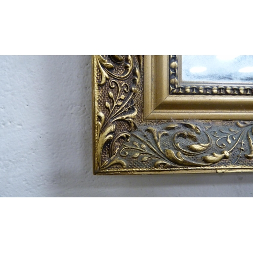 85 - Modern gilt-framed wall mirror.