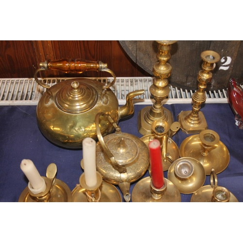 13 - Large collection of brass ware to include an 'amber' handled kettle, candlesticks, tortoise models, ... 