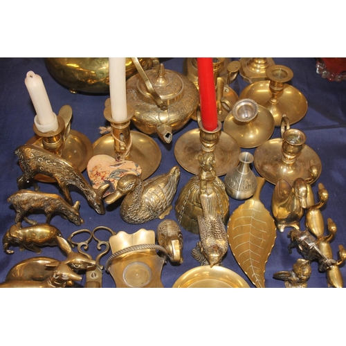 13 - Large collection of brass ware to include an 'amber' handled kettle, candlesticks, tortoise models, ... 