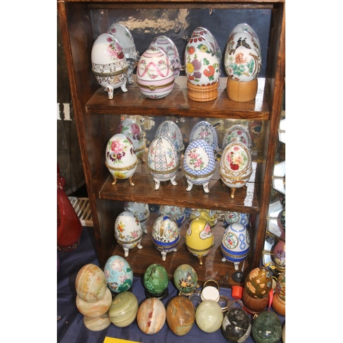 15 - Large collection of eggs to include OC & Co porcelain trinket boxes, malachite, onyx and other h... 