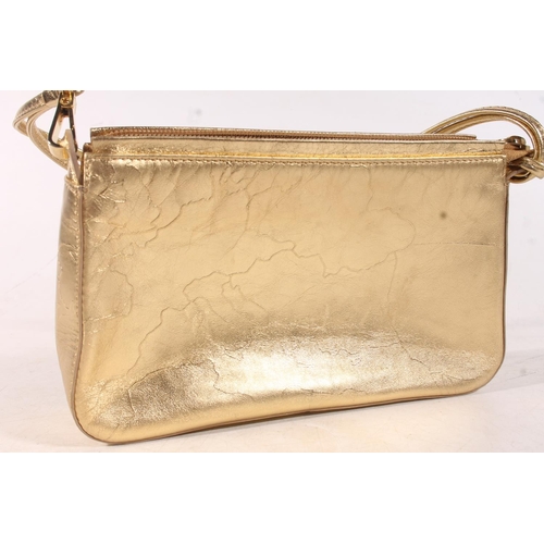 39 - Italian designer gold coloured handbag by Alviero Martini and a pair of Han Kjobenhaven Danish desig... 