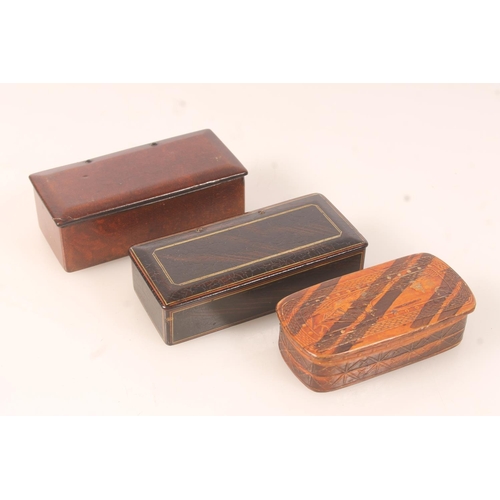 45 - Two papier mache snuff boxes and a carved wooden snuff box depicting maritime scene. (3)