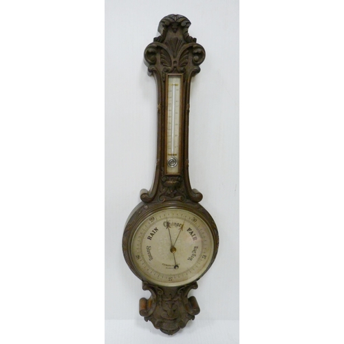 221 - Edward & Sons of Glasgow carved mahogany banjo barometer with thermometer gauge above a signed d... 