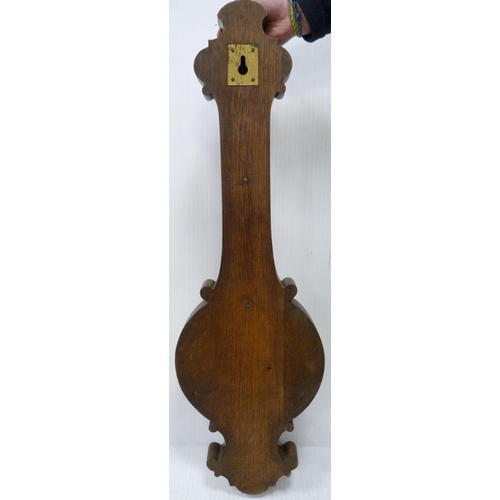 221 - Edward & Sons of Glasgow carved mahogany banjo barometer with thermometer gauge above a signed d... 