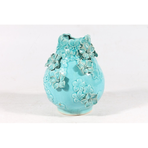 67 - Studio pottery floral blue glaze vase, H18cm.