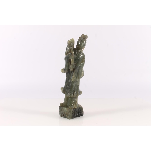 69 - Chinese spinach jade figurine of an attendant, 23cm high.