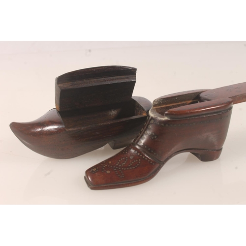 40 - Two carved treen snuff boxes in the form of shoes or boots. (2)