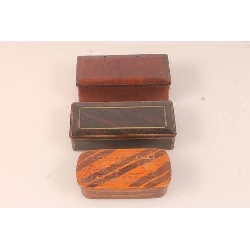 45 - Two papier mache snuff boxes and a carved wooden snuff box depicting maritime scene. (3)