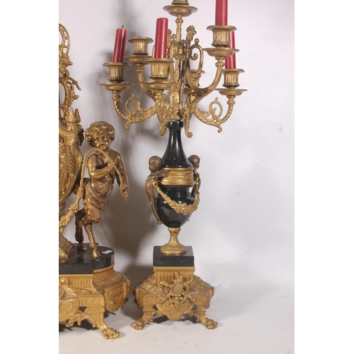 64 - Mid-20th century Italian black and gilt metal clock garniture set.