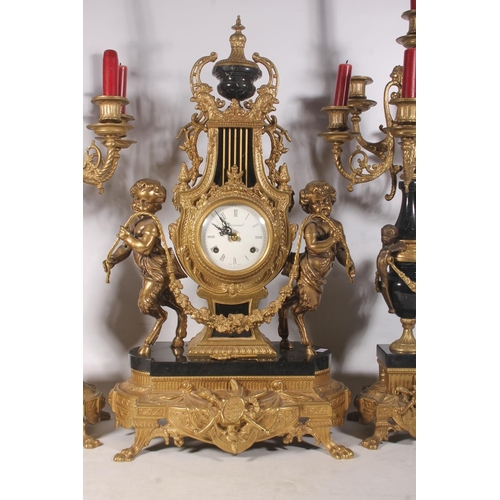 64 - Mid-20th century Italian black and gilt metal clock garniture set.