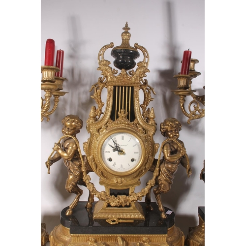 64 - Mid-20th century Italian black and gilt metal clock garniture set.