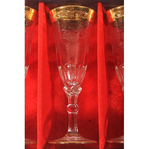 66 - Cased set of gilt enamel Italian wine glasses.