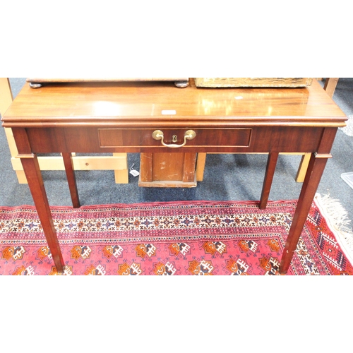 644 - Victorian mahogany fold over tea table with single frieze drawer.