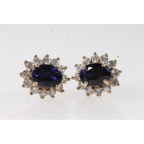 424 - Pair of 9ct gold blue and white stone earrings, the reverse stamped '9K', 2.9g.