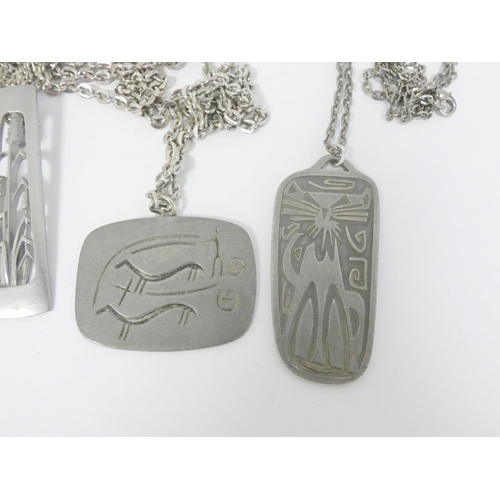 55 - Four Jorgen Jensen pewter plaque pendants.