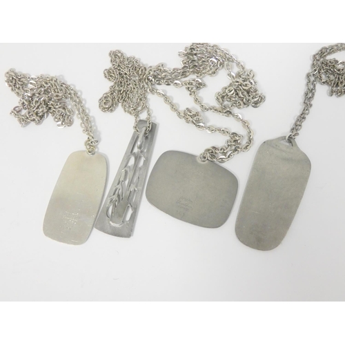 55 - Four Jorgen Jensen pewter plaque pendants.