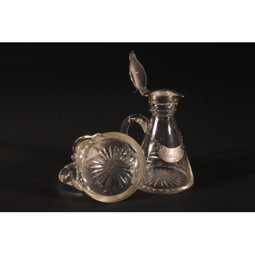 32 - Pair of Edwardian whisky noggins, the hinged silver covers over a conical glass bottle with star cut... 