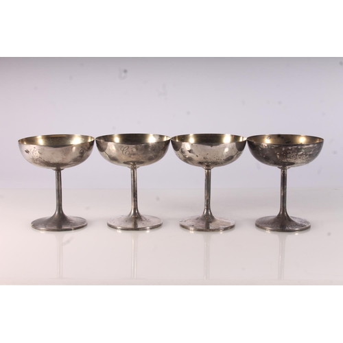 33 - Four Geo. V silver trophy cups, of coupe form on thin stems, with gilt bowls, Elkington and Co. Birm... 