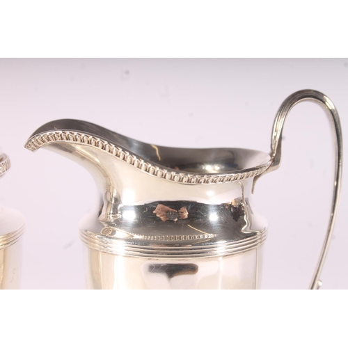 34 - Geo. V silver strawberry set, the jug and sifter of conforming fluted design with gadrooned borders,... 