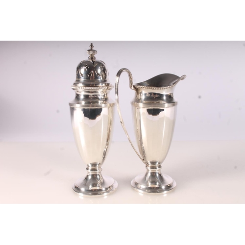 34 - Geo. V silver strawberry set, the jug and sifter of conforming fluted design with gadrooned borders,... 