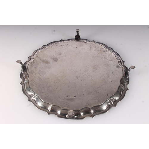 35 - Edwardian silver salver, engraved with foliate scrolls within a cast piecrust rim, on four pad feet,... 