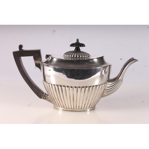 36 - Victorian silver three piece tea service, the teapot with ebonized handle and finial over a half lob... 