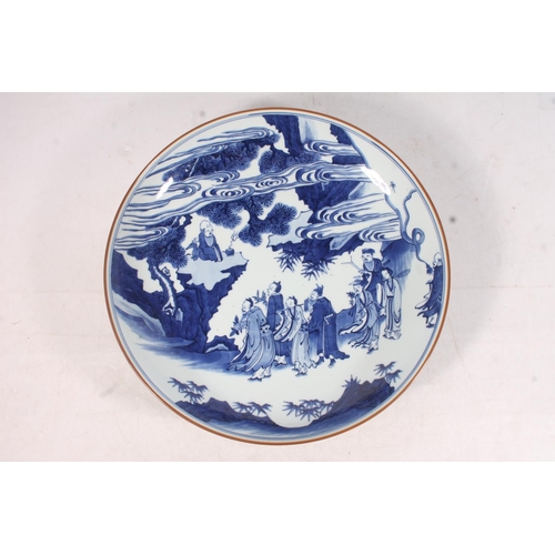 437 - Chinese Kangxi style blue and white charger, Painted with a scene of figures looking up at an immort... 