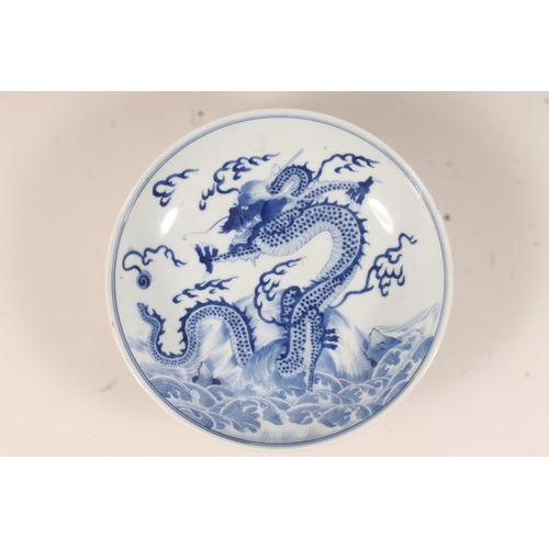 439 - Chinese blue and white dragon dish, Decorated with the four claw dragon chasing the flaming pearl, w... 