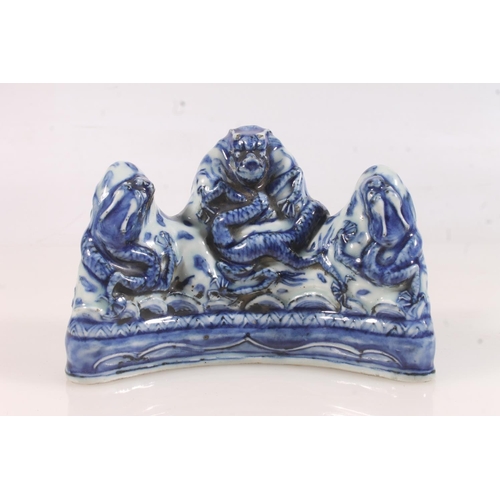 440 - Chinese blue and white dragon brush rest, moulded with the five claw dragon, extended six character ... 