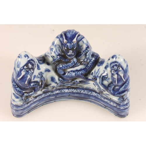 440 - Chinese blue and white dragon brush rest, moulded with the five claw dragon, extended six character ... 